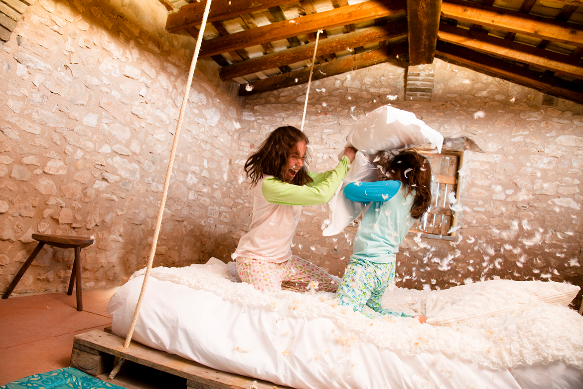 Girls play in a converted attic bedroom