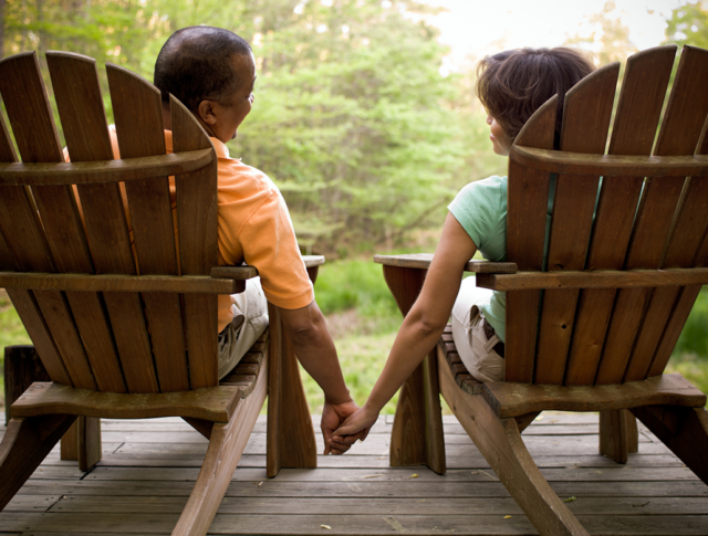 Couple in adirondack chairs enjoying time outdoors