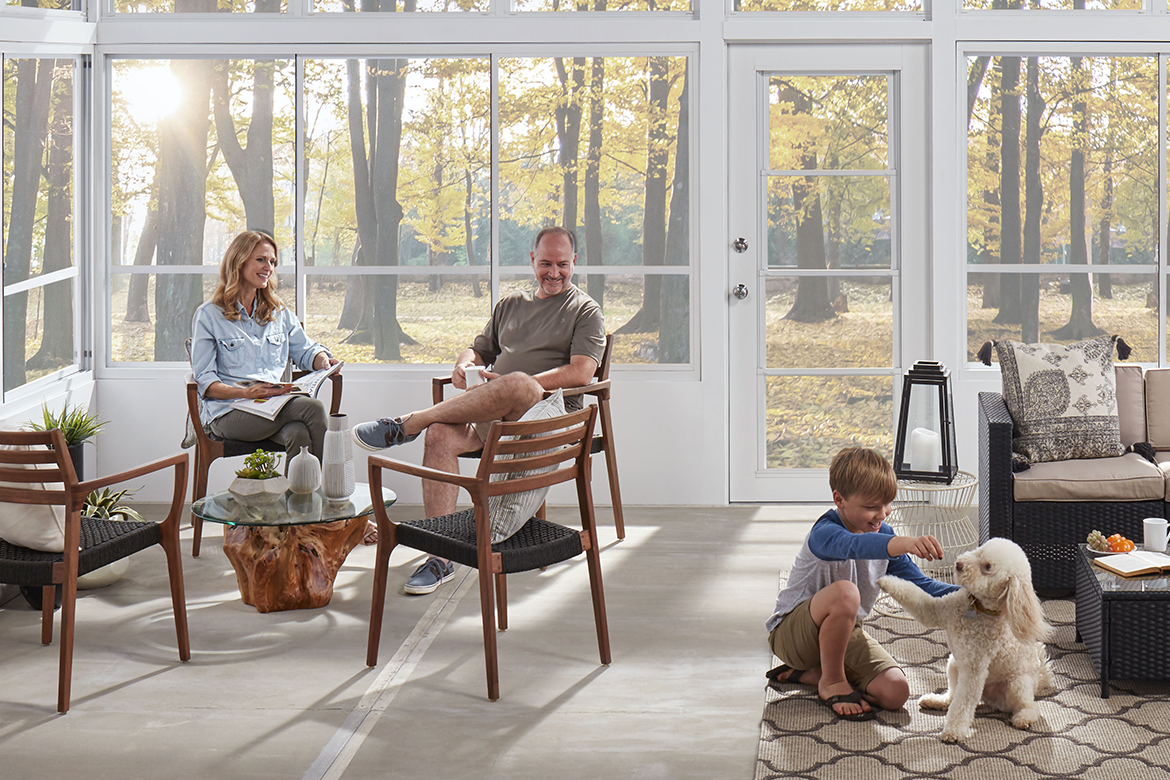Family enjoying the outdoors in their Eze-Breeze patio conversion